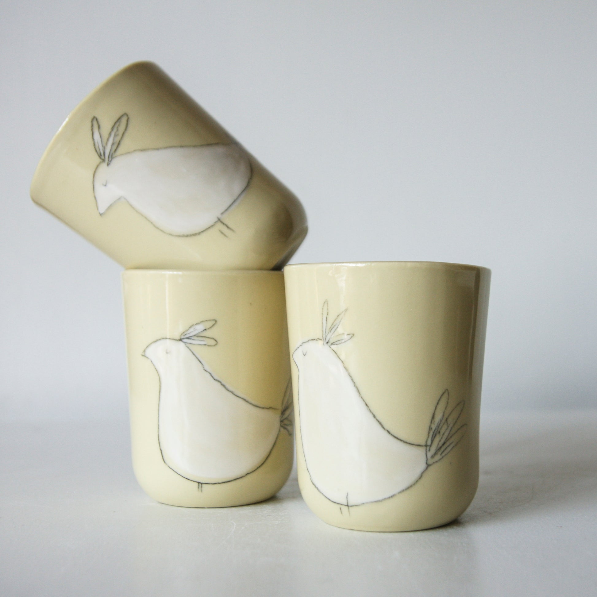 Bird Tumbler, yellow-green porcelain