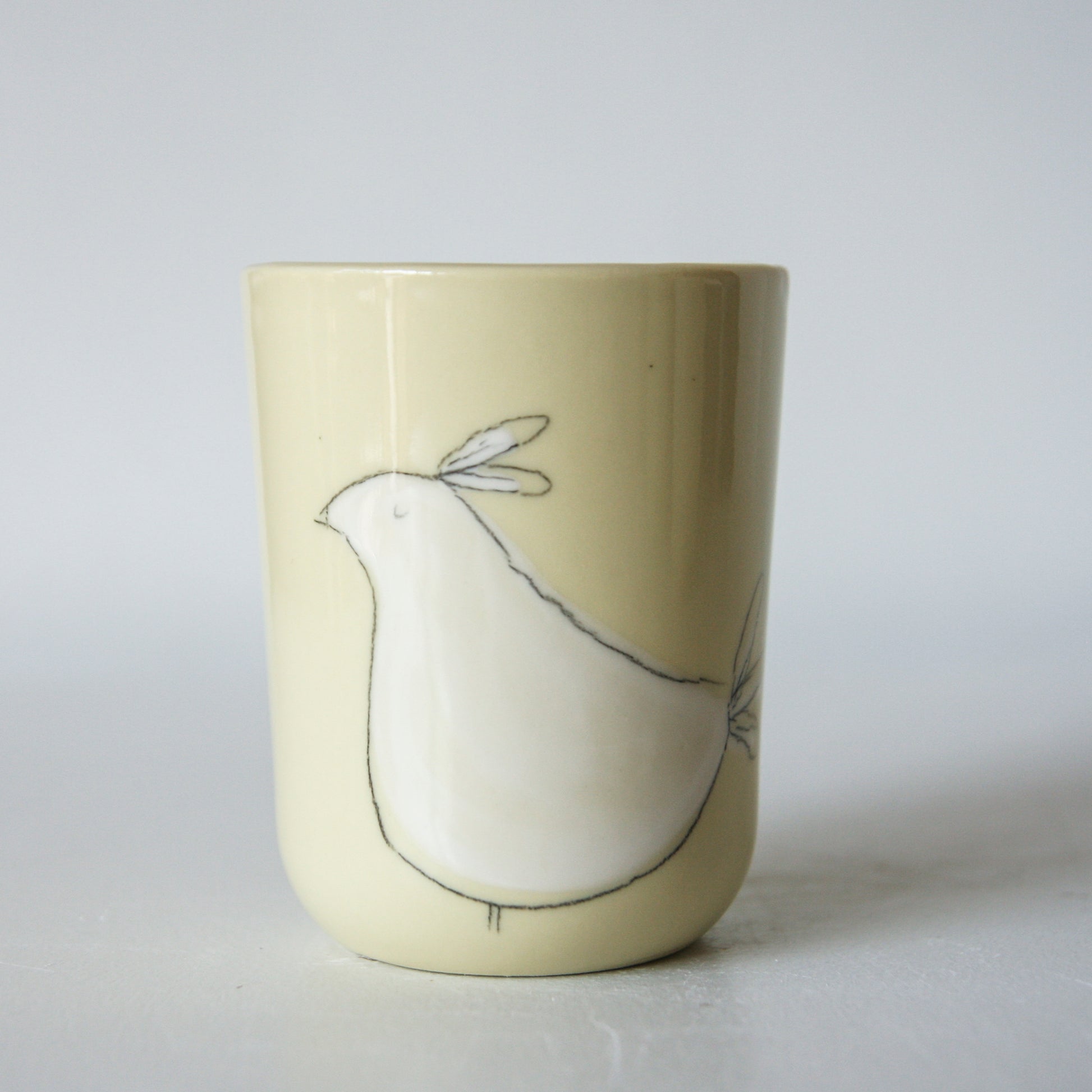 Bird Tumbler, yellow-green porcelain