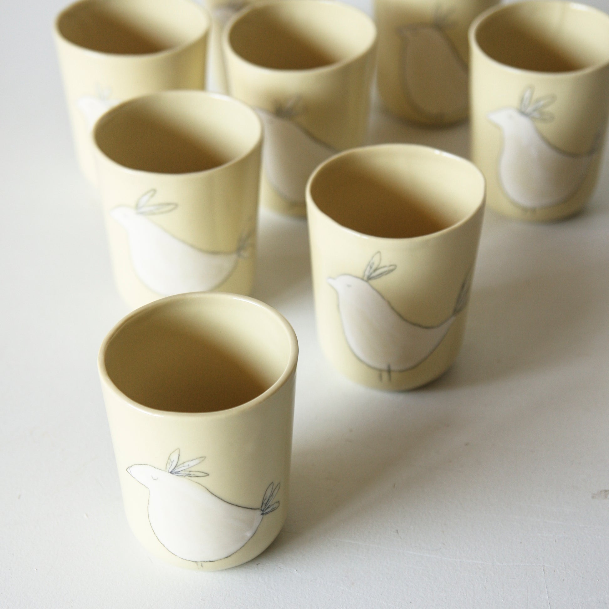 Bird Tumbler, yellow-green porcelain