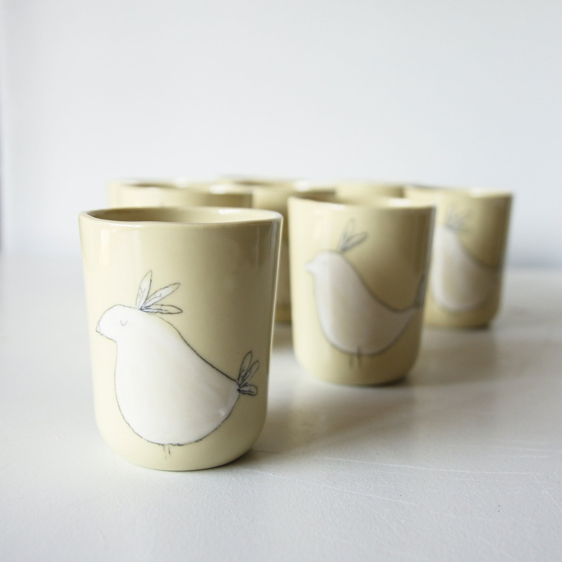 Bird Tumbler, yellow-green porcelain