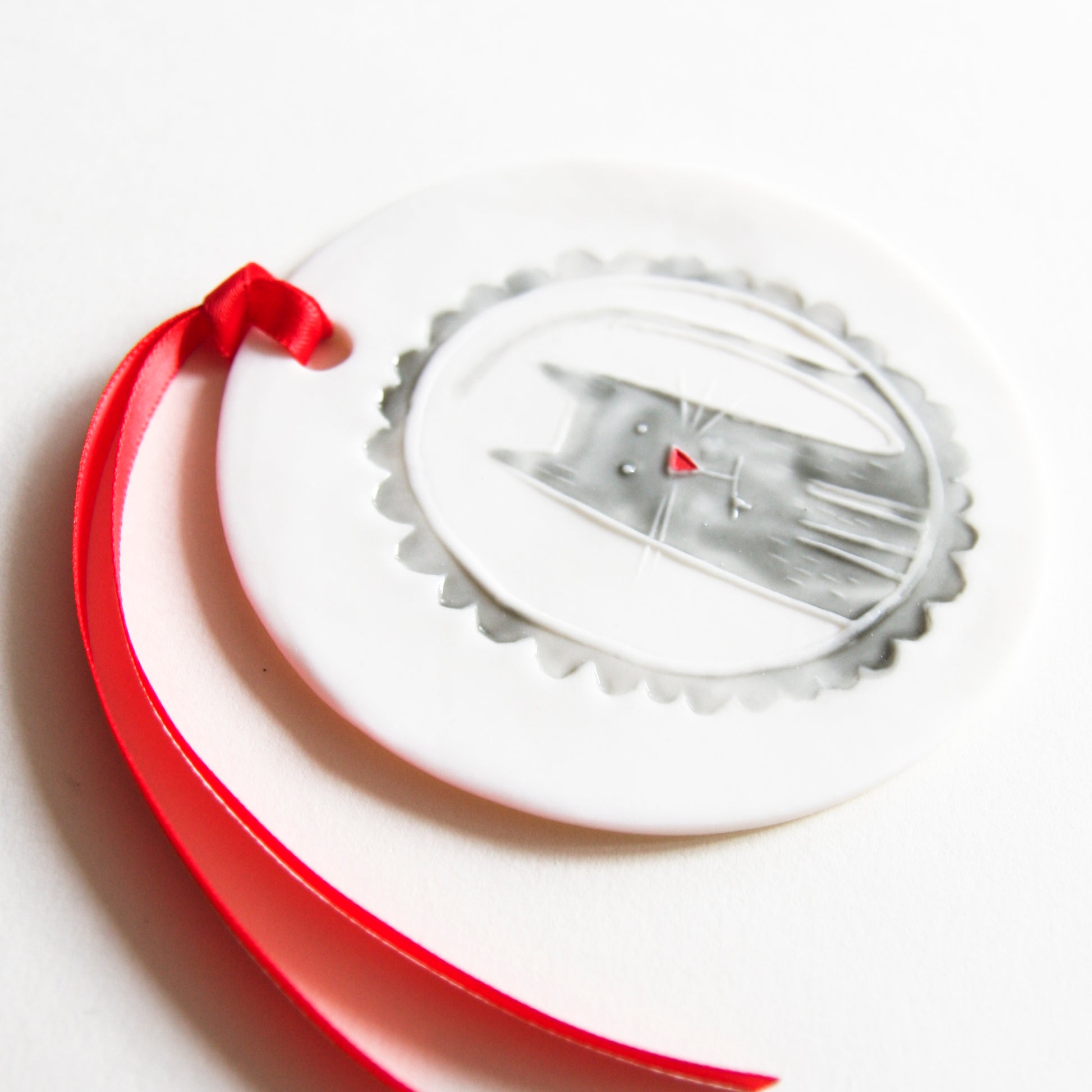 CAT disc ornament